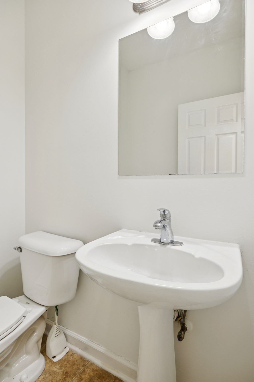 2015 Keene Circle Spring Hill, TN 37174 - Photo 15 of 37 a bathroom with a sink a toilet and mirror
