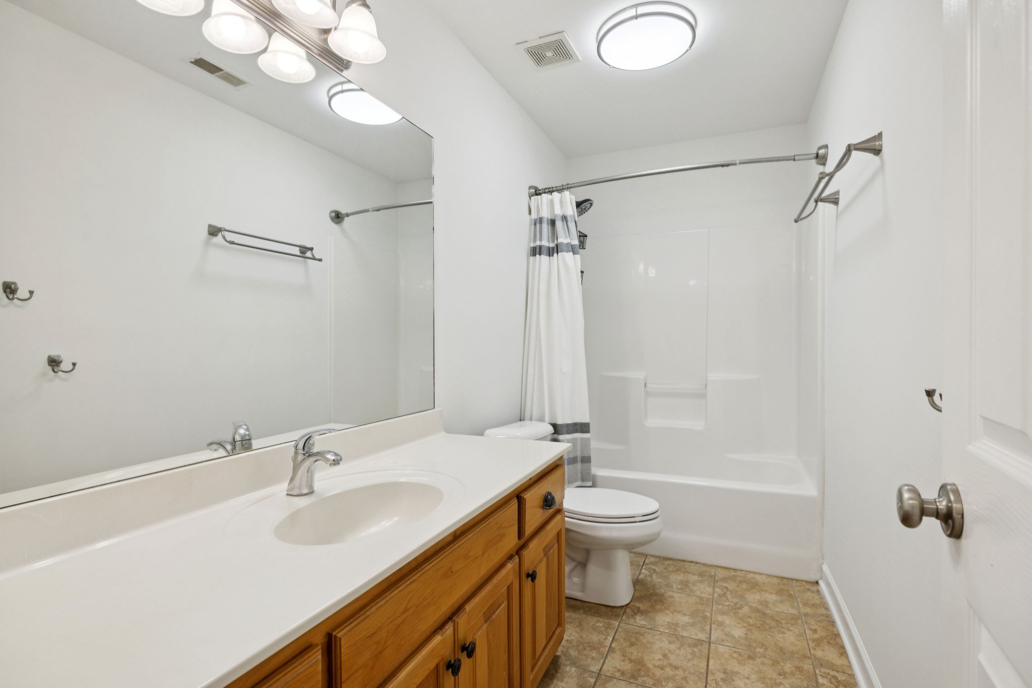 2015 Keene Circle Spring Hill, TN 37174 - Photo 26 of 37 a bathroom with a sink a toilet and shower