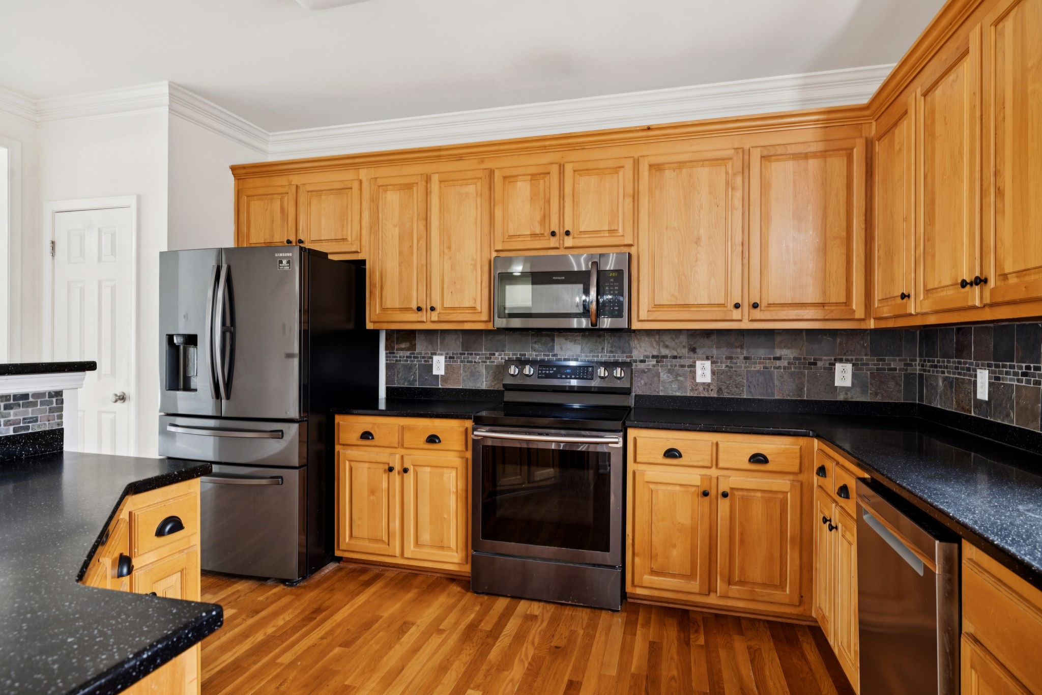 2015 Keene Circle Spring Hill, TN 37174 - Photo 8 of 37 a kitchen with stainless steel appliances granite countertop a refrigerator a stove top oven a sink and dishwasher