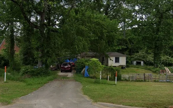 a view of a house with a back yard