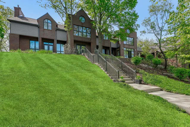 a front view of a house with a yard