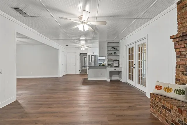 a view of kitchen with furniture and wooden floor