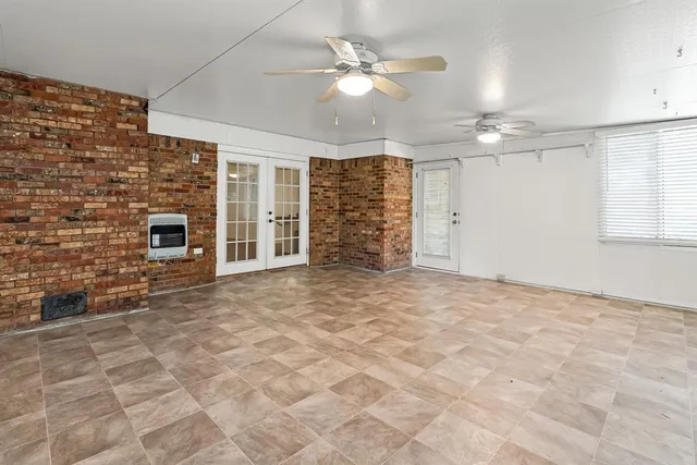 a view of an empty room with a fireplace