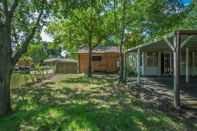 a view of backyard with green space
