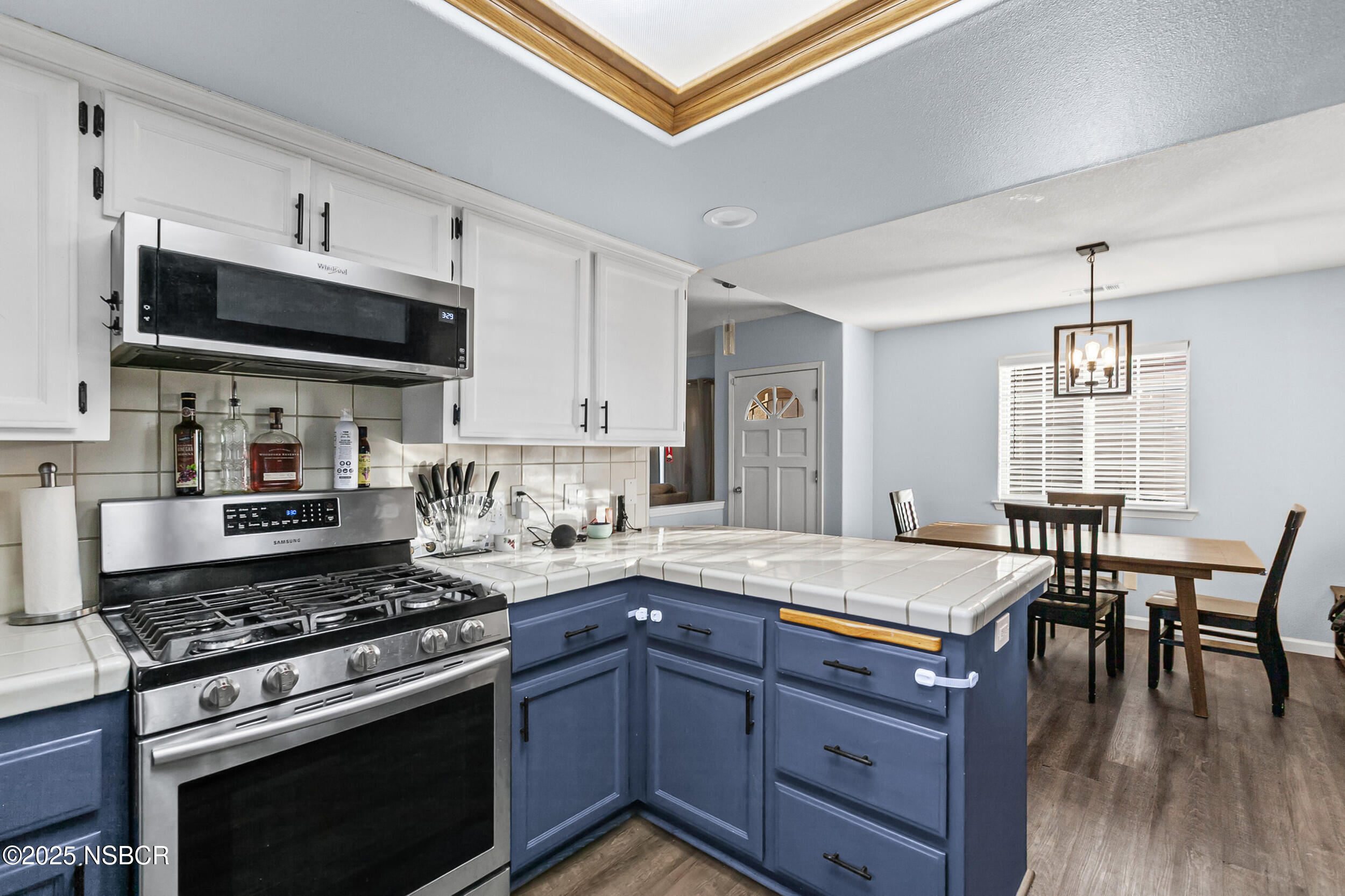 2442 Acacia Street Santa Maria, CA 93458 - Photo 11 of 27 a kitchen with a stove a sink and a refrigerator