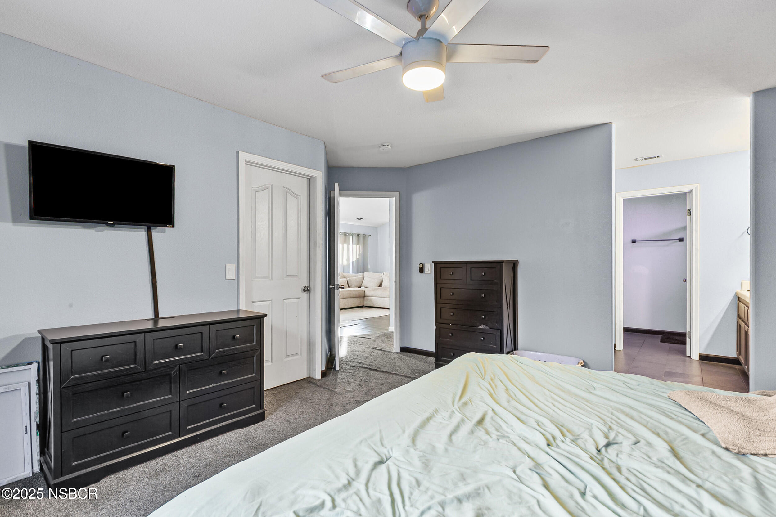 2442 Acacia Street Santa Maria, CA 93458 - Photo 13 of 27 a bedroom with a bed and a flat screen tv