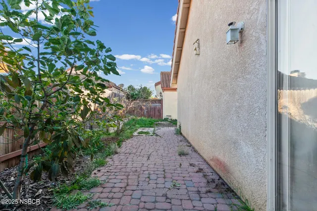 a view of a pathway with a yard