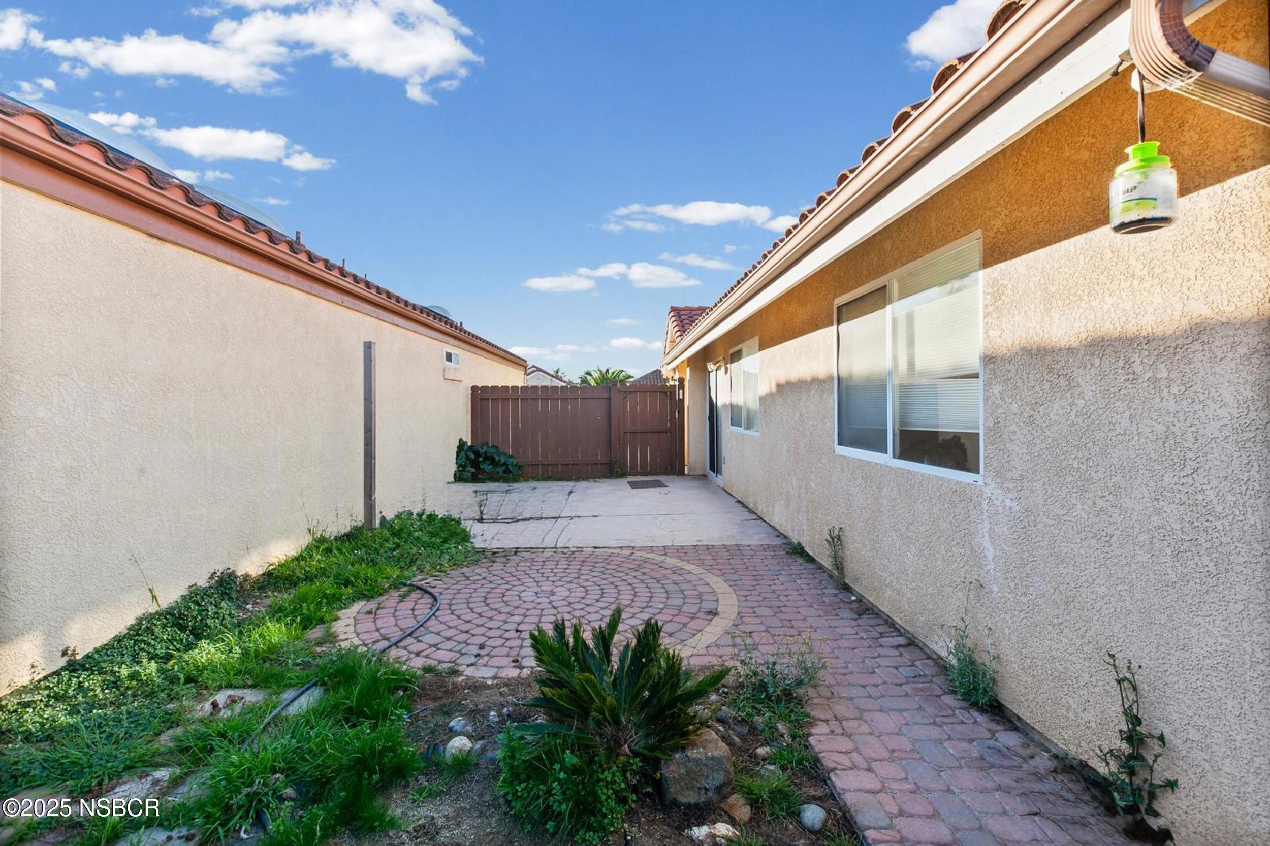 2442 Acacia Street Santa Maria, CA 93458 - Photo 15 of 27 a view of a back yard of the house