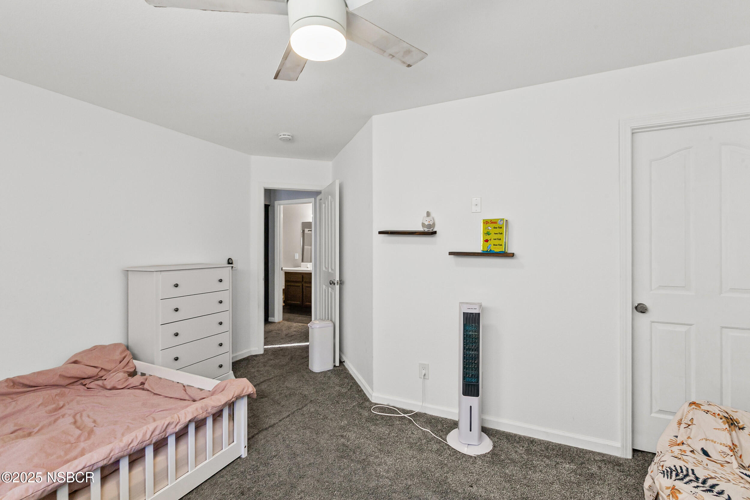 2442 Acacia Street Santa Maria, CA 93458 - Photo 17 of 27 a bedroom with a bed and a window