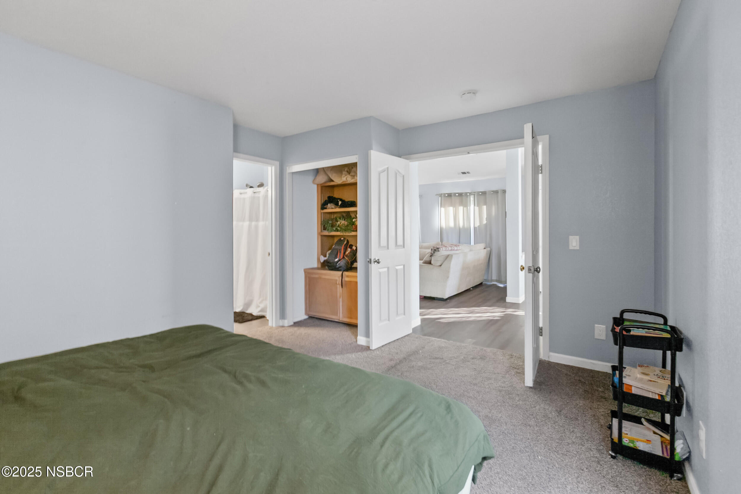 2442 Acacia Street Santa Maria, CA 93458 - Photo 20 of 27 a bedroom with a bed and a view of bathroom