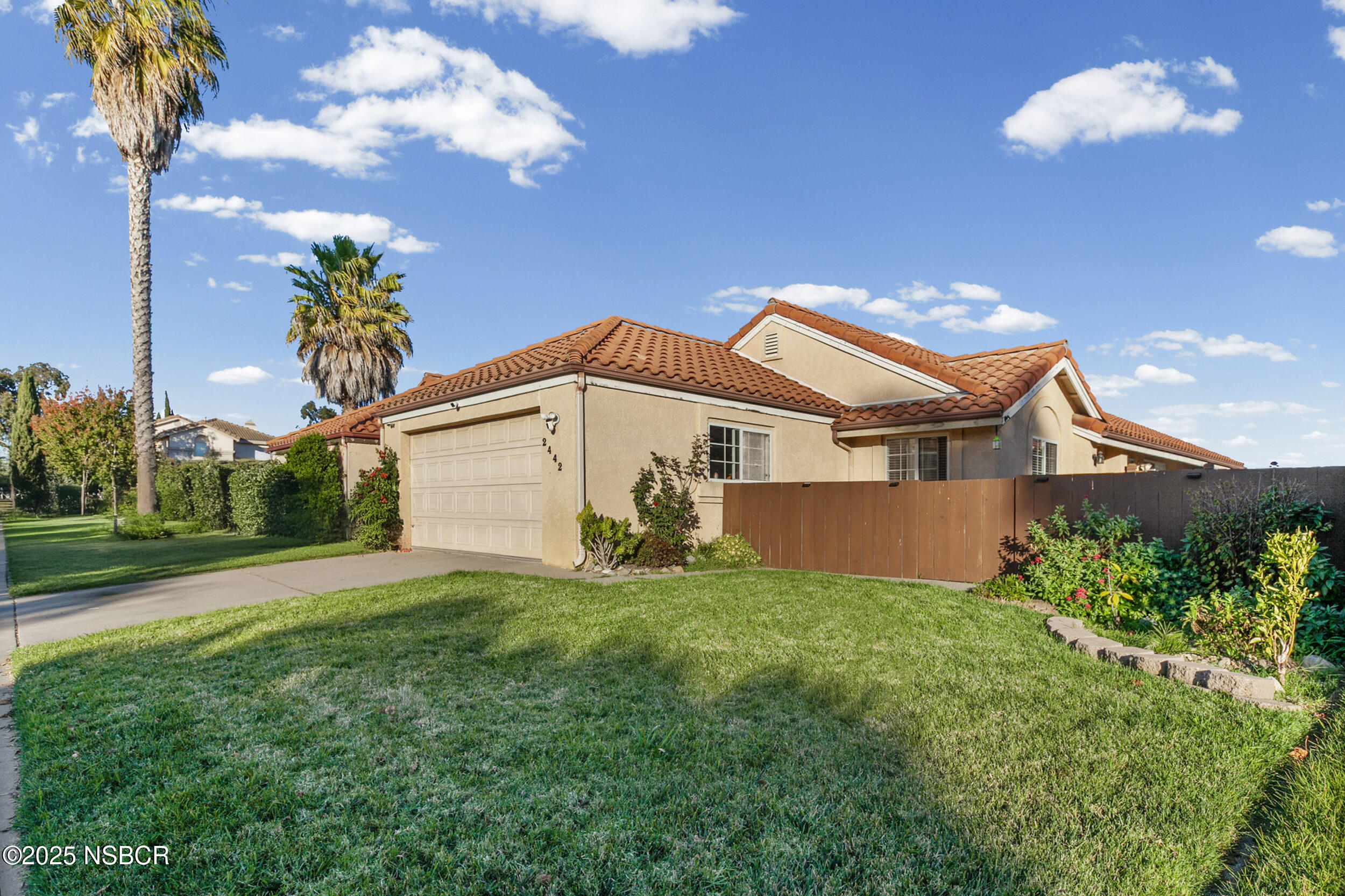 2442 Acacia Street Santa Maria, CA 93458 - Photo 2 of 27 a view of a house with a yard