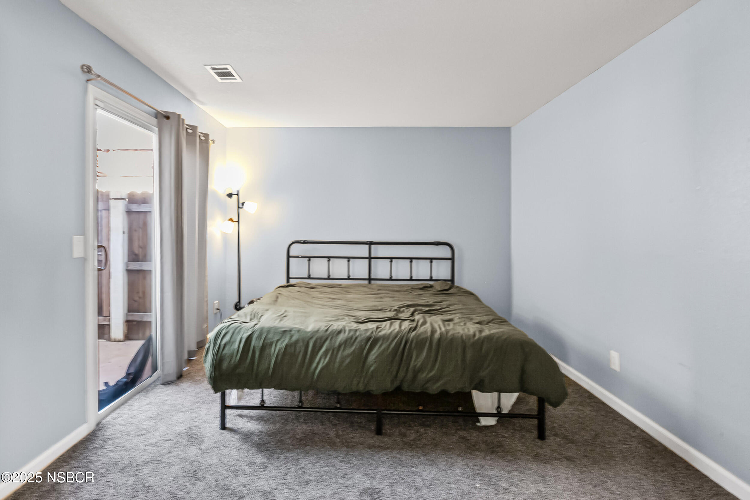 2442 Acacia Street Santa Maria, CA 93458 - Photo 21 of 27 a bedroom with a bed and a table