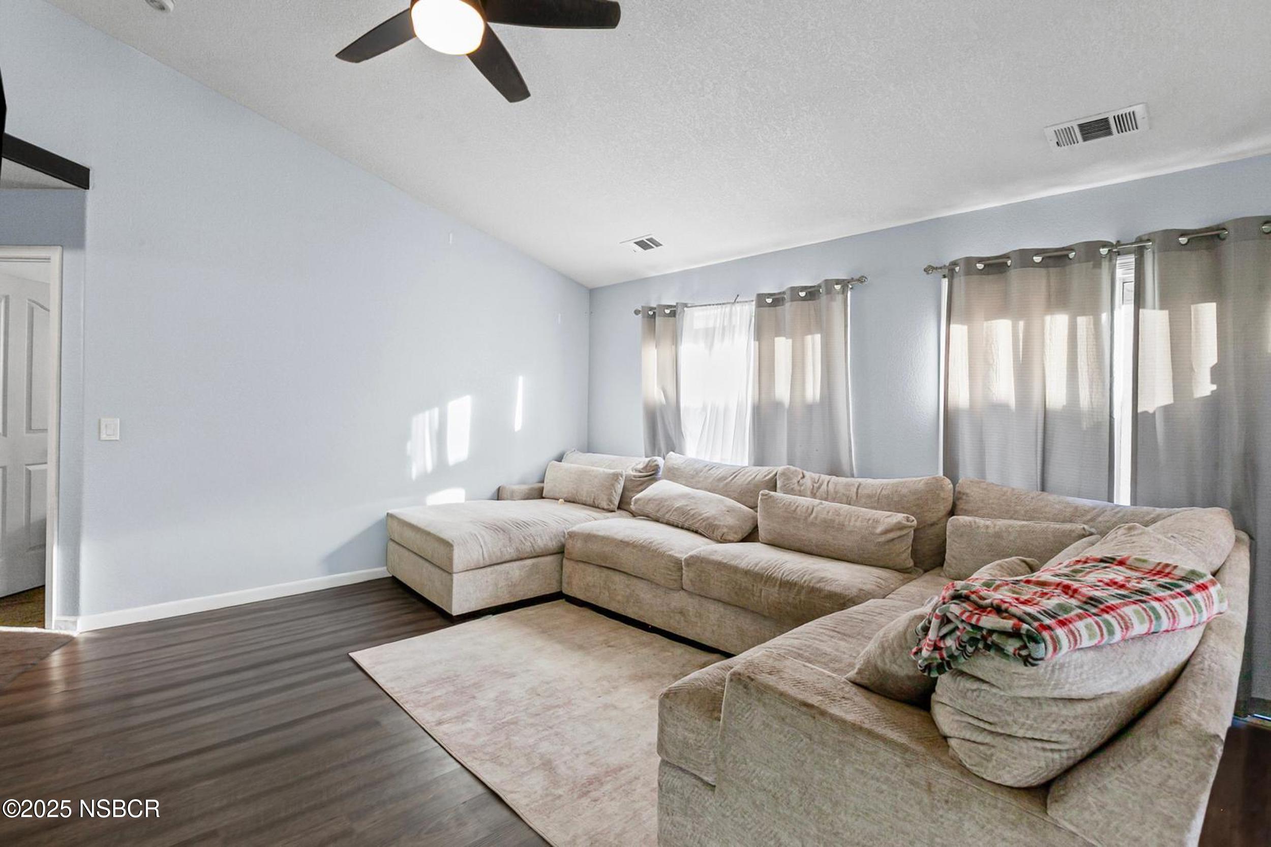 2442 Acacia Street Santa Maria, CA 93458 - Photo 22 of 27 a living room with furniture and large windows