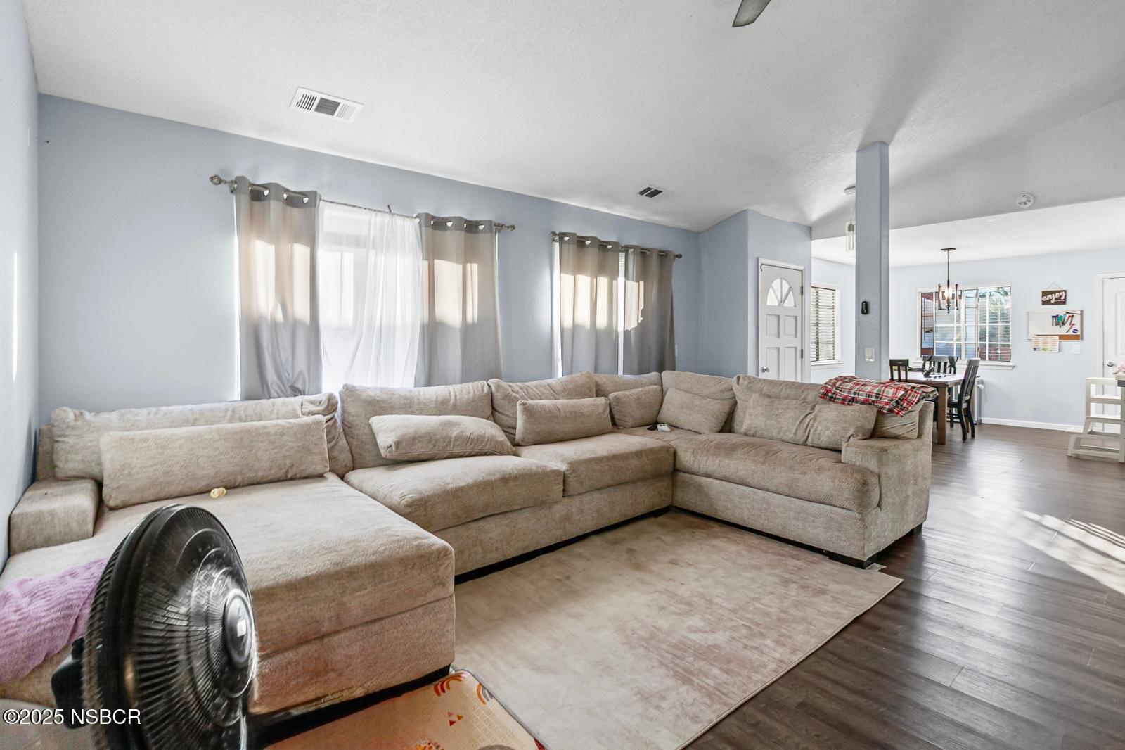 2442 Acacia Street Santa Maria, CA 93458 - Photo 23 of 27 a living room with furniture and wooden floor