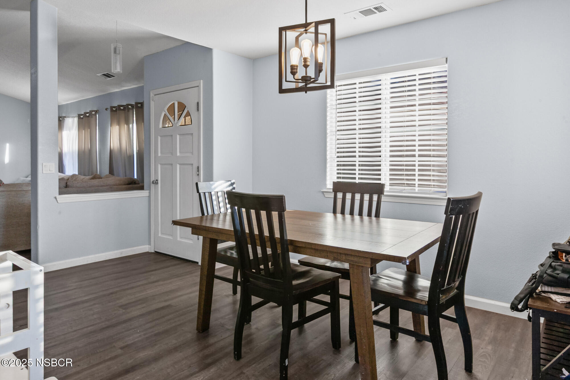 2442 Acacia Street Santa Maria, CA 93458 - Photo 7 of 27 a view of a dining room with furniture and wooden floor
