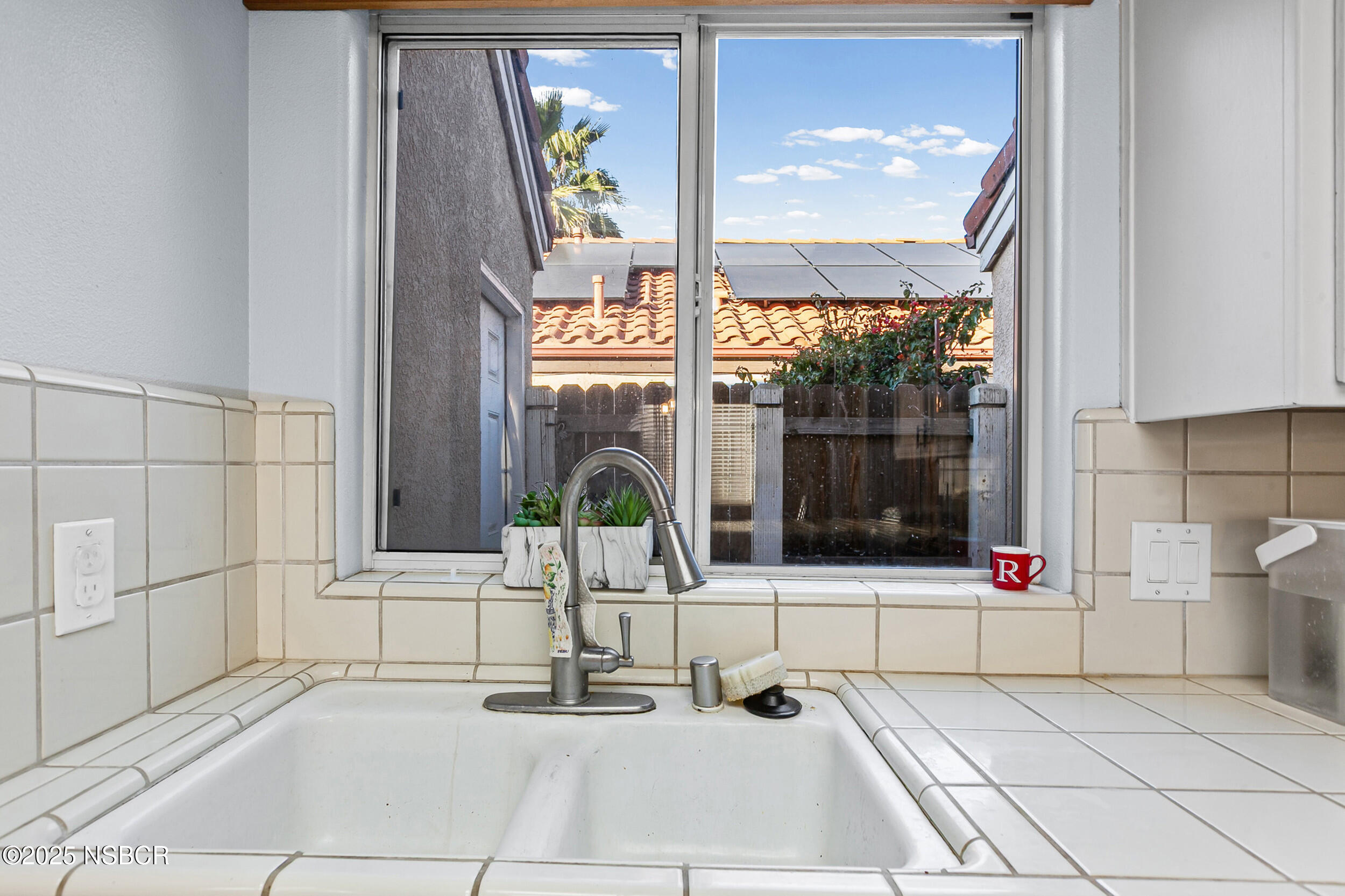 2442 Acacia Street Santa Maria, CA 93458 - Photo 9 of 27 a building with glass door and window