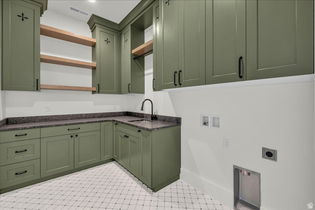 1620 Belayer Drive St. George, UT 84770 - Photo 20 of 51 Laundry area featuring olive green cabinetry, dark stone countertops, a corner sink with a black faucet, and white patterned floor tiling