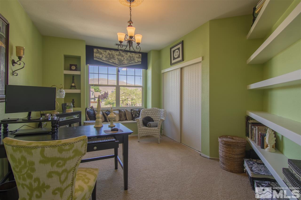 9621 Apache Rose Court Reno, NV 89521 - Photo 20 of 25 a living room with furniture and a chandelier