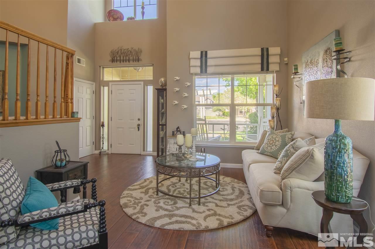 9621 Apache Rose Court Reno, NV 89521 - Photo 5 of 25 a living room with furniture and a large window