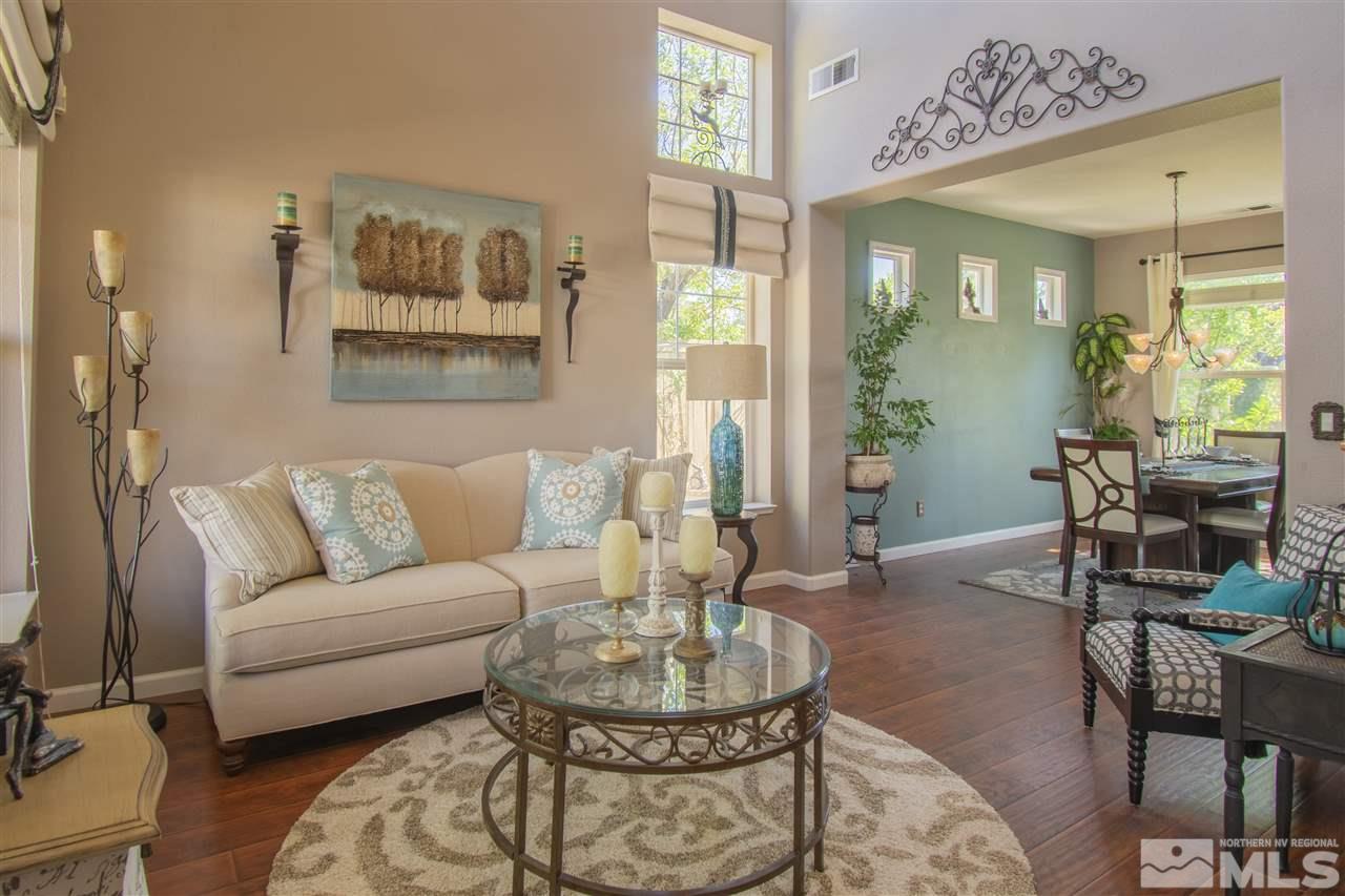 9621 Apache Rose Court Reno, NV 89521 - Photo 6 of 25 a living room with furniture and a dining table