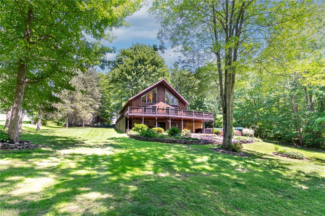 7733 East Port Bay Road Wolcott, NY 14590 - Photo 1 of 49 Expert landscaping at this gorgeous country home! It offers a dock - waterfront and plenty of room to roam with over 3 acres of land!