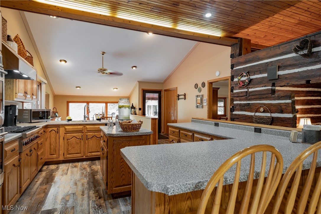 8089 Elk Fork Road Middlebourne, WV 26149 - Photo 7 of 50 Gormet Kitchen, With Custom Hand Made Solid Oak Cabinets, Premium Stainless Stell Appliances, Premium LVT Flooring, Breakfast Bar, Large Pantry, French Doors to Deck, Custom Lighting