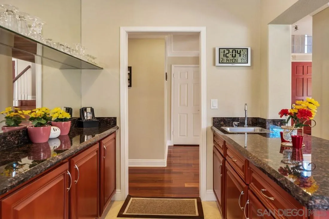 14513 Wildgrove Road Poway, CA 92064 - Photo 11 of 39 a kitchen with a sink and cabinets