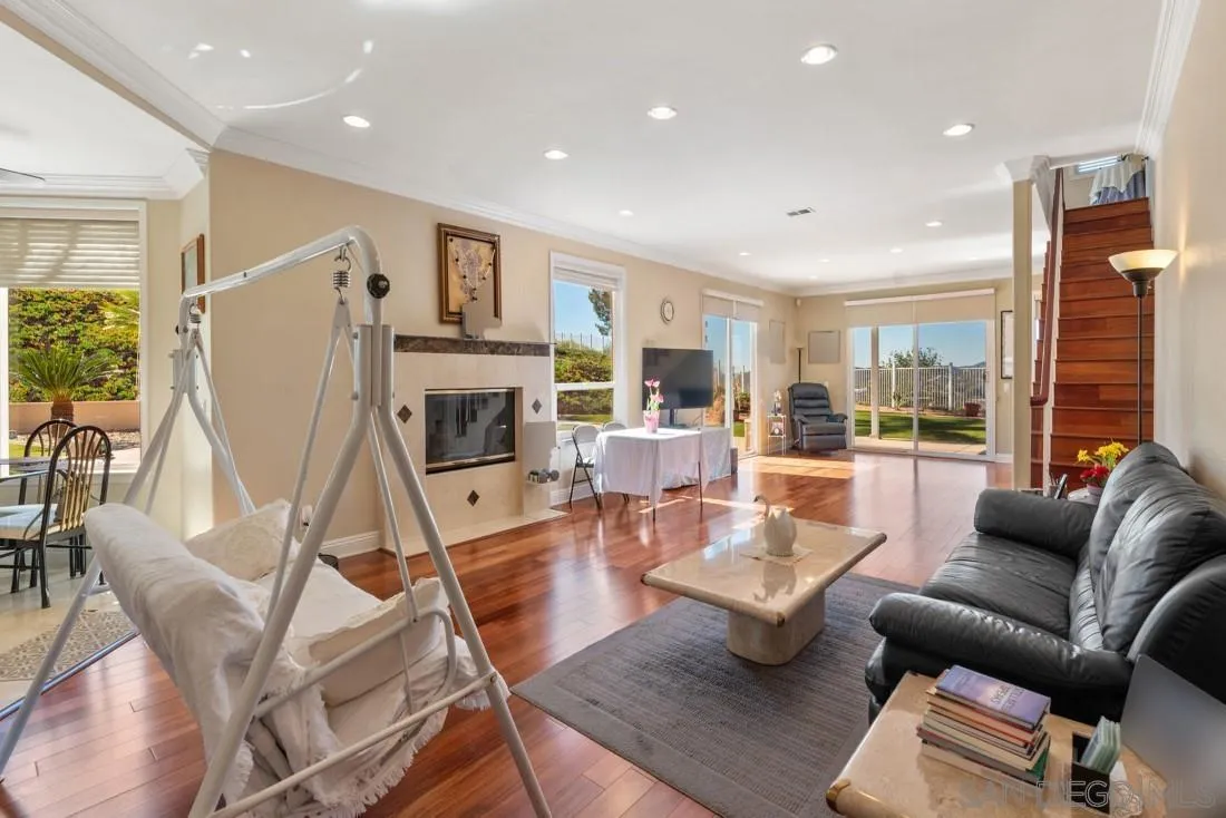 14513 Wildgrove Road Poway, CA 92064 - Photo 16 of 39 a living room with fireplace furniture and a wooden floor