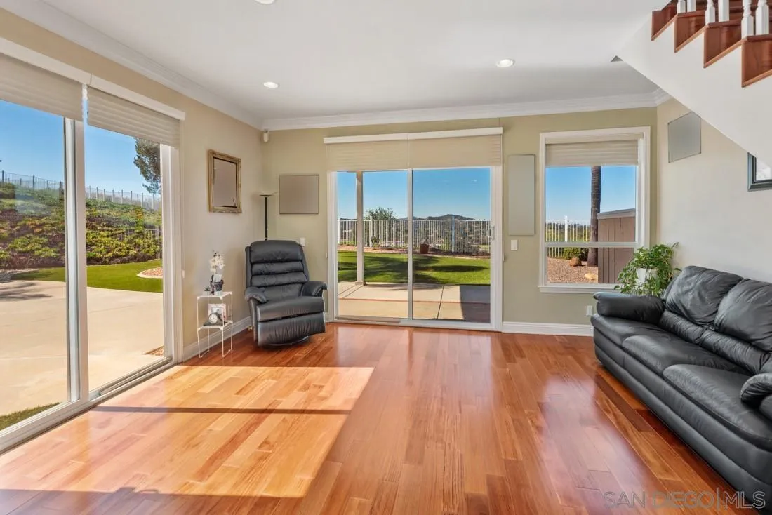 14513 Wildgrove Road Poway, CA 92064 - Photo 19 of 39 a living room with furniture and a floor to ceiling window