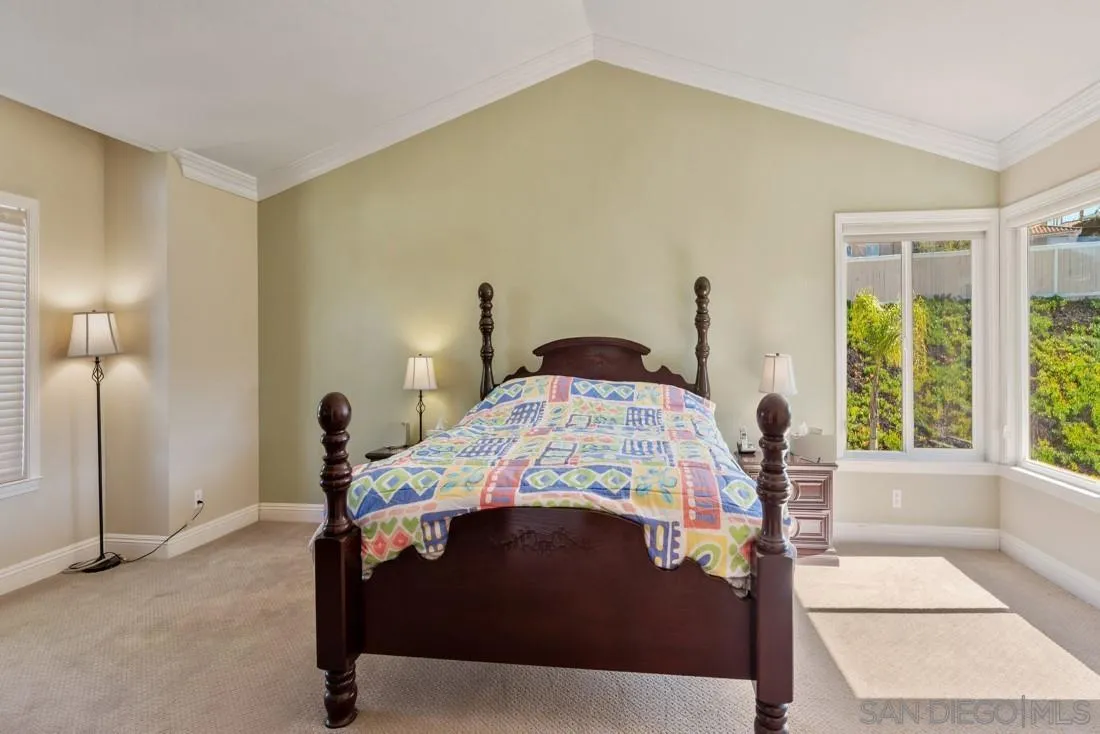 14513 Wildgrove Road Poway, CA 92064 - Photo 22 of 39 a bedroom with a bed and a large window