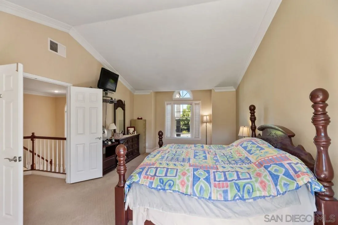 14513 Wildgrove Road Poway, CA 92064 - Photo 23 of 39 a bedroom with a bed and a large mirror on the dresser