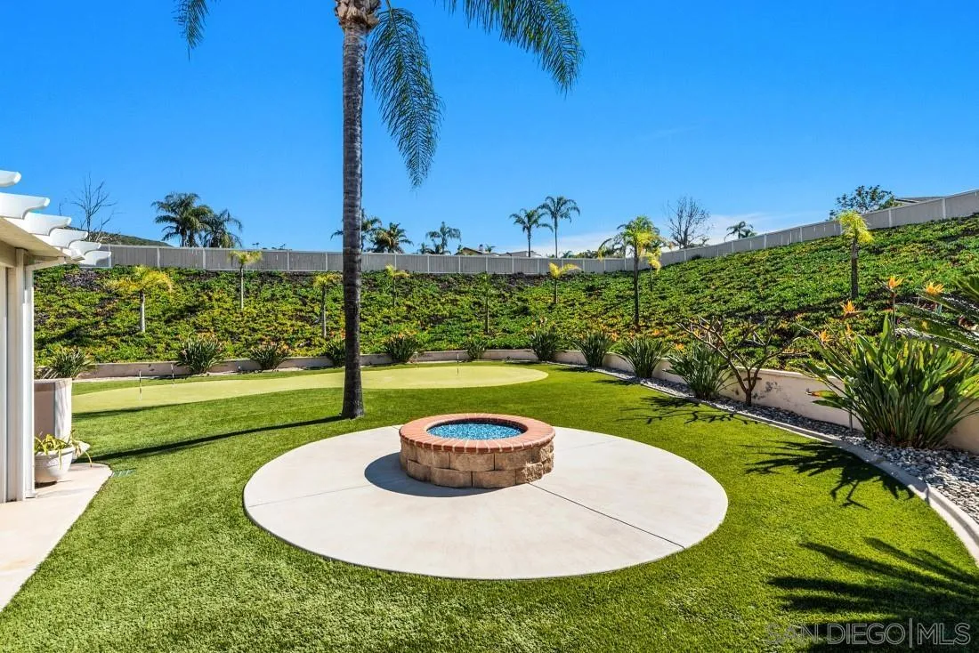 14513 Wildgrove Road Poway, CA 92064 - Photo 34 of 39 a view of a swimming pool with a yard
