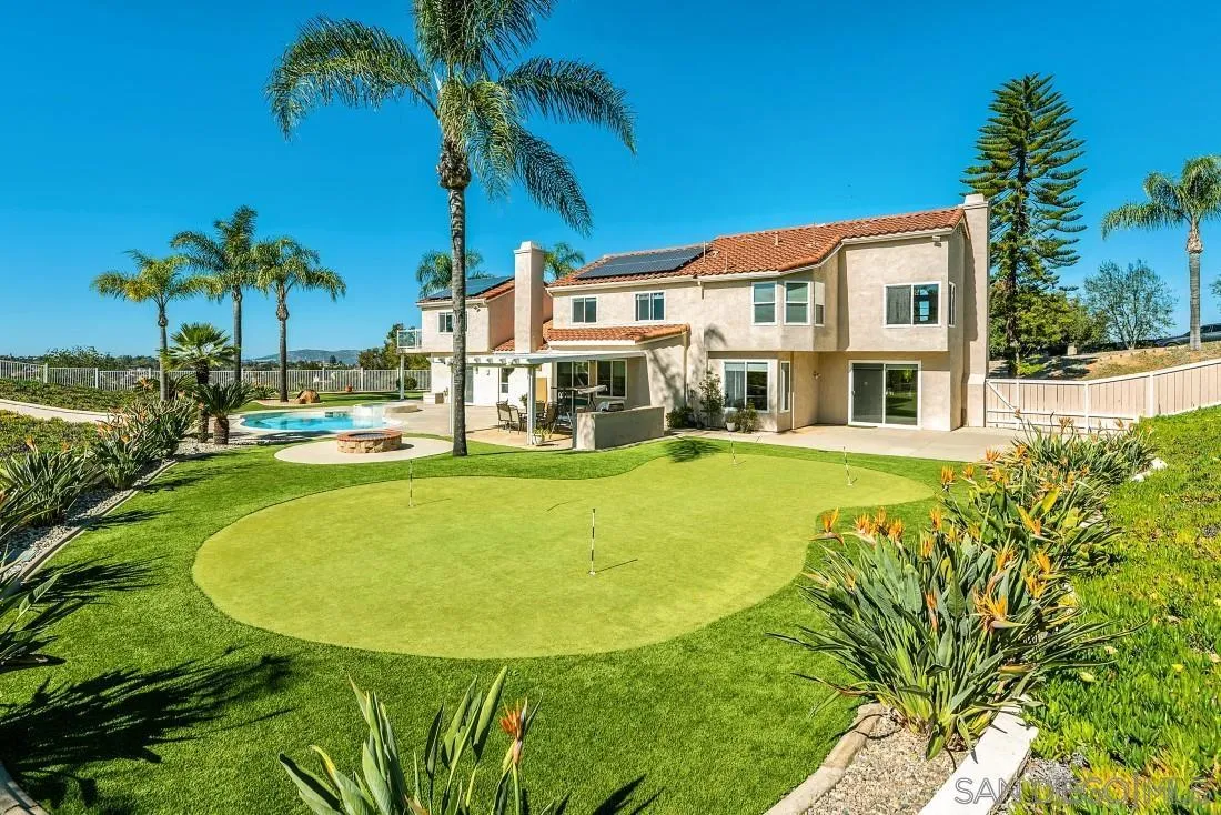 14513 Wildgrove Road Poway, CA 92064 - Photo 35 of 39 a view of a swimming pool with a garden