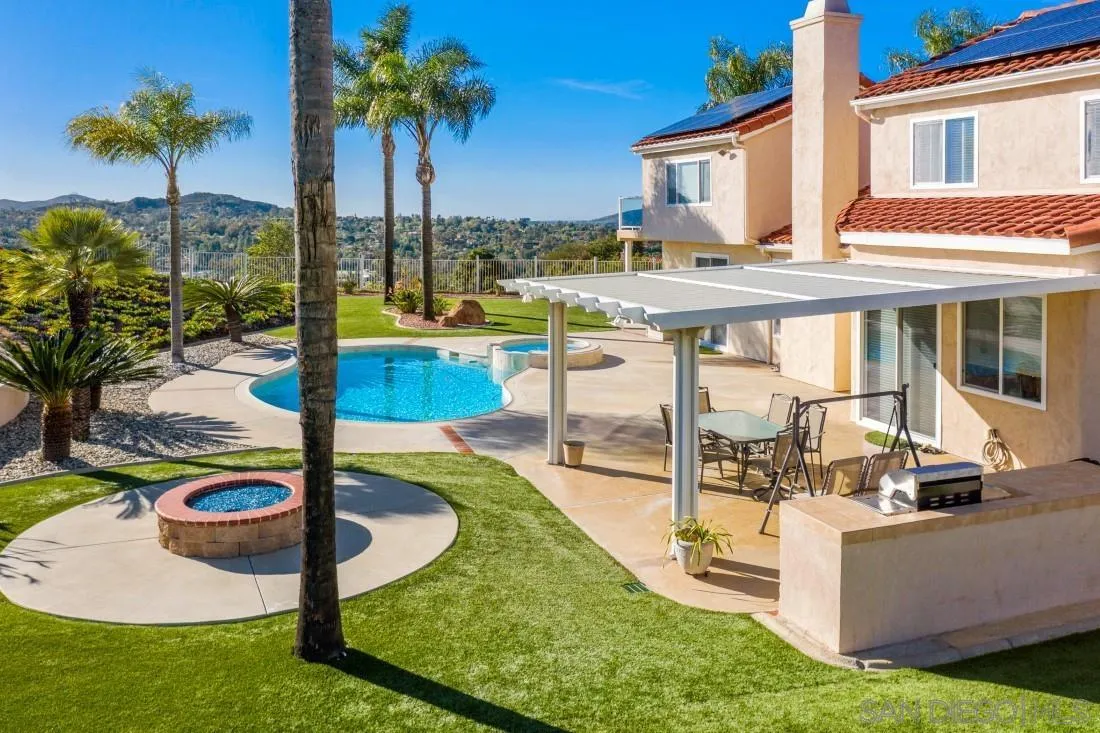 14513 Wildgrove Road Poway, CA 92064 - Photo 37 of 39 a view of a swimming pool with a lounge chairs