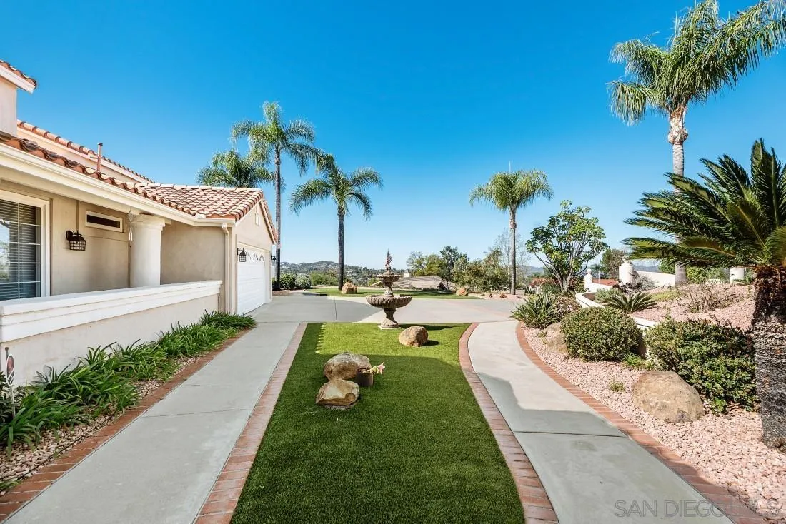 14513 Wildgrove Road Poway, CA 92064 - Photo 4 of 39 a view of a swimming pool with a garden