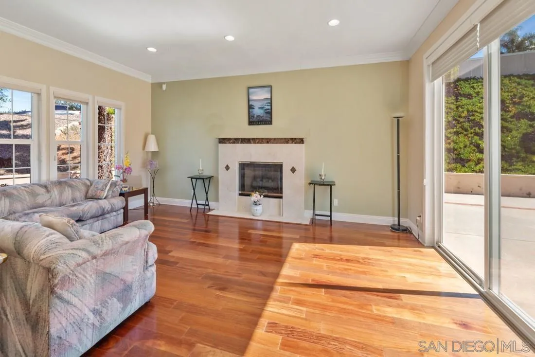 14513 Wildgrove Road Poway, CA 92064 - Photo 7 of 39 a living room with furniture and a fireplace