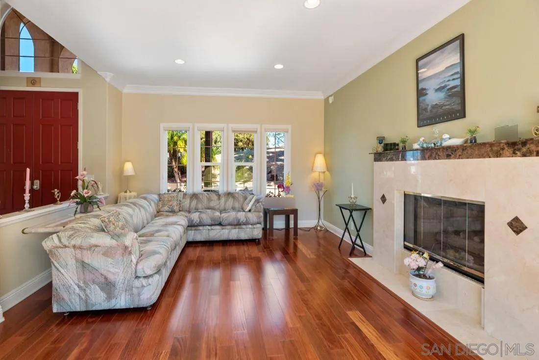 14513 Wildgrove Road Poway, CA 92064 - Photo 8 of 39 a living room with furniture and a fireplace