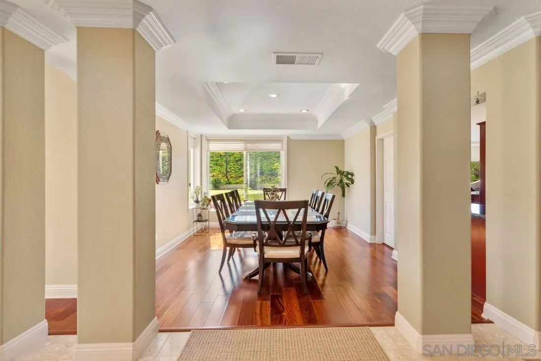 14513 Wildgrove Road Poway, CA 92064 - Photo 9 of 39 a view of a dining room with furniture and a potted plant