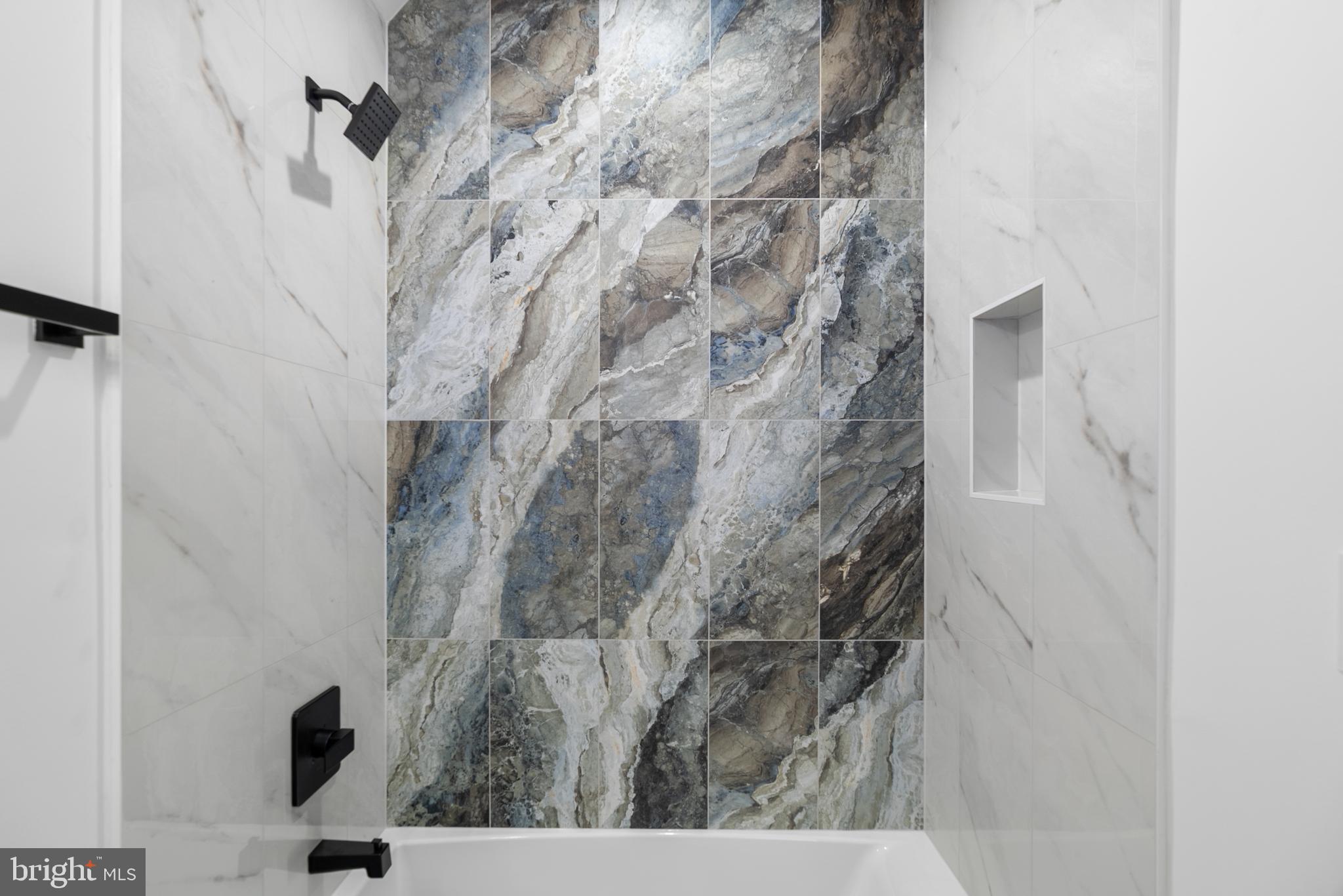 1140 Oates Street Northeast, Unit 102 Washington, DC 20002 - Photo 20 of 40 a bathroom with a shower