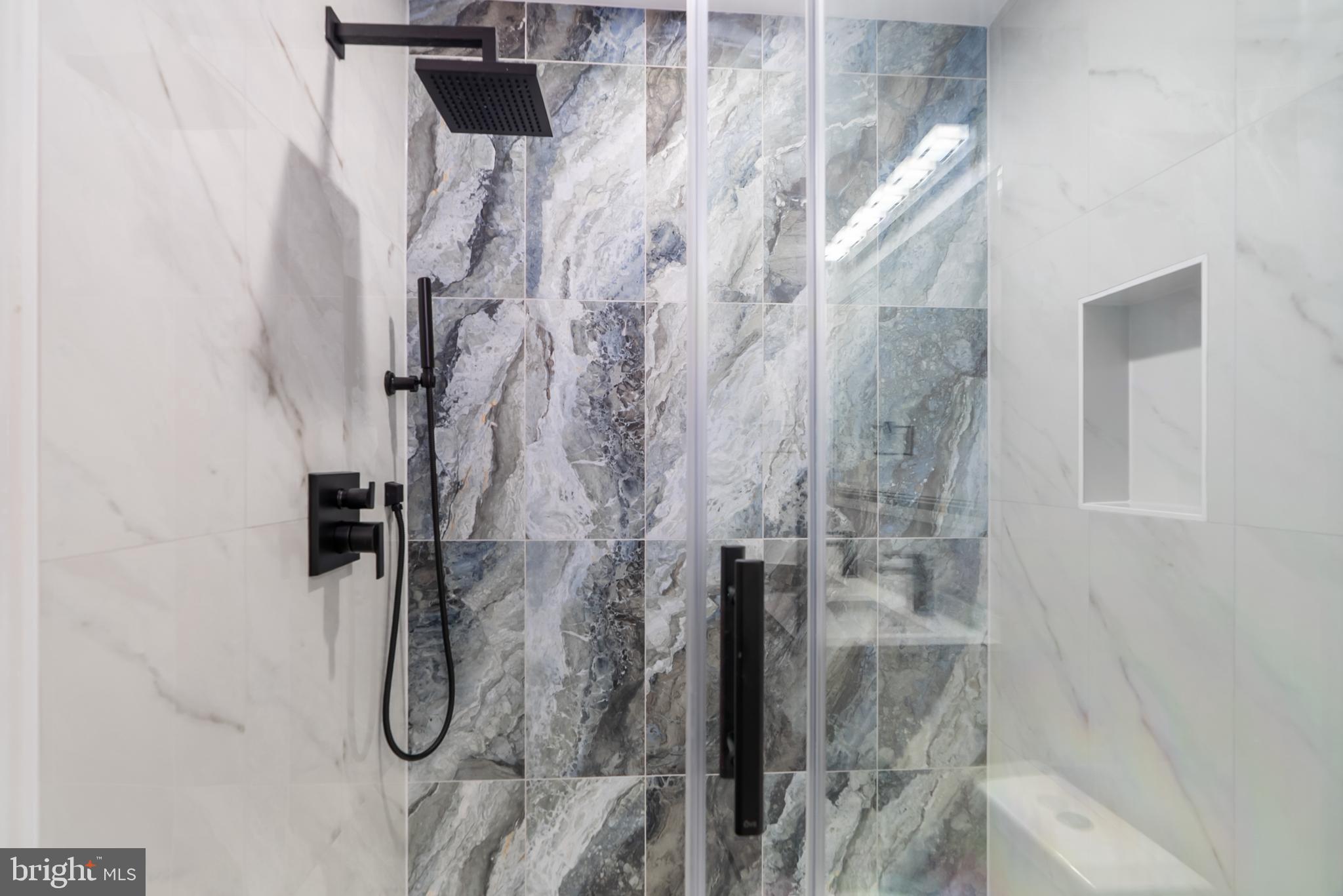 1140 Oates Street Northeast, Unit 102 Washington, DC 20002 - Photo 36 of 40 a bathroom with a shower