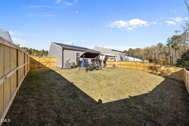 a view of a swimming pool with an outdoor seating