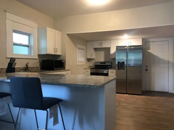 a view of a dining room with furniture
