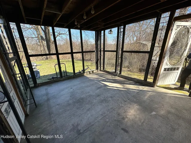 a view of an empty room with a balcony