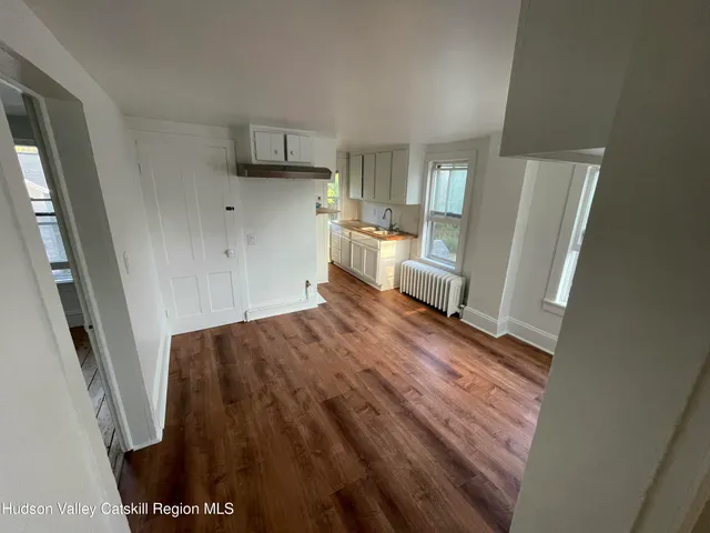 a view of a kitchen from the hallway
