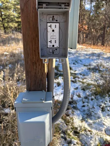 a front view of a house with fountain