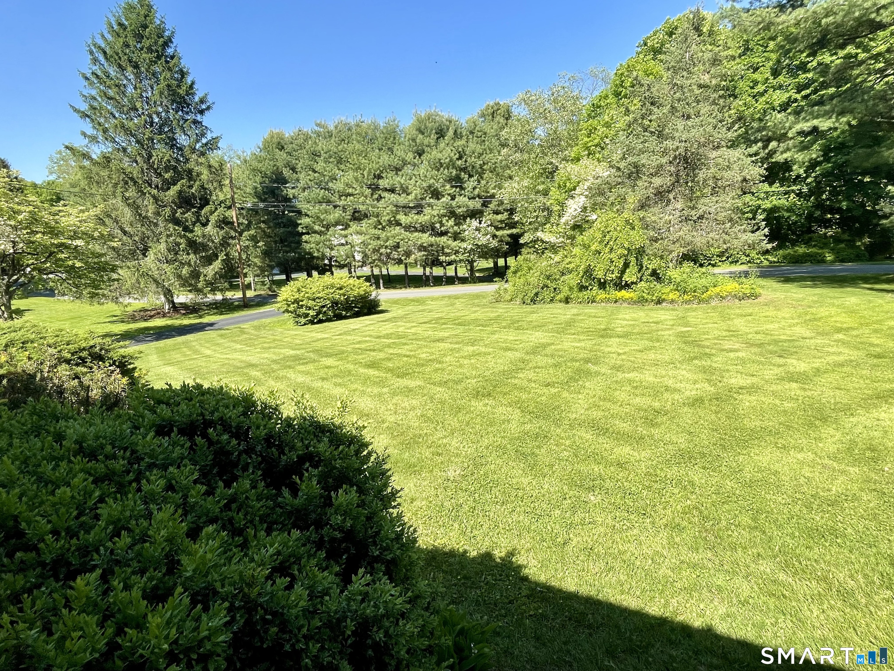 9 Apple Lane Redding, CT 06896 - Photo 23 of 39 Gentle rolling lawn toward the driveway to the left