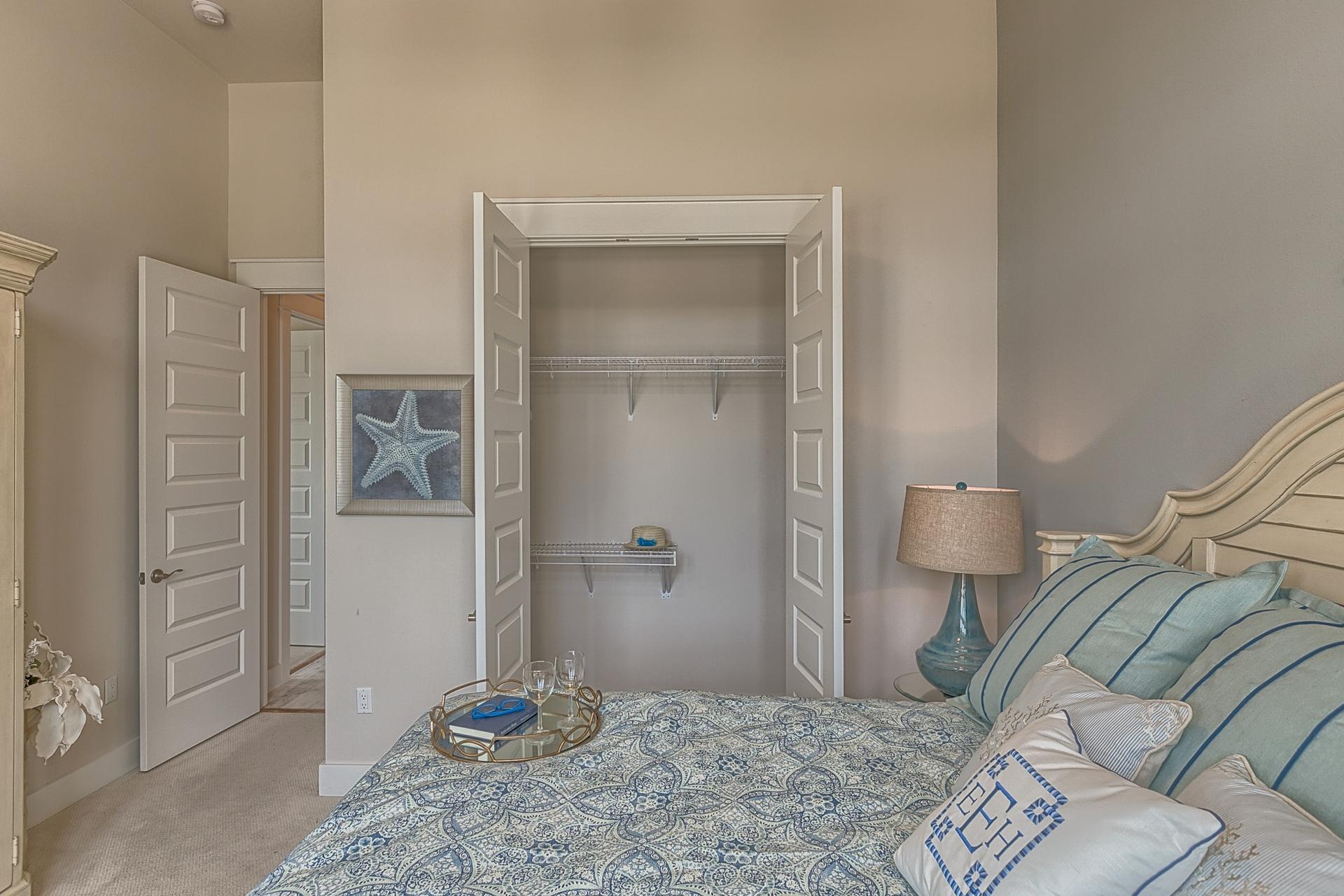189 Milestone Dr Inlet Beach, Unit 189 Inlet Beach, FL 32461 - Photo 7 of 32 a bedroom with a bed and a mirror