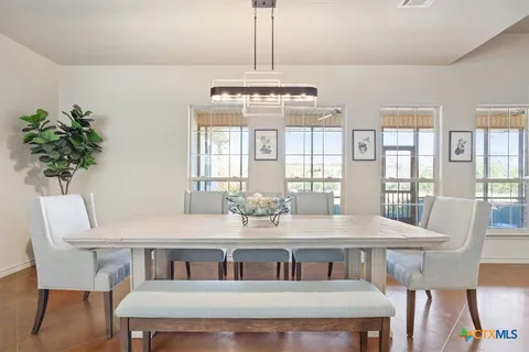 a view of a dining room with furniture window and outside view