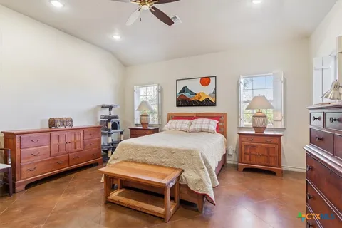 a bedroom with a bed and furniture