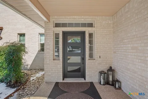 a front view of a house with a outdoor space